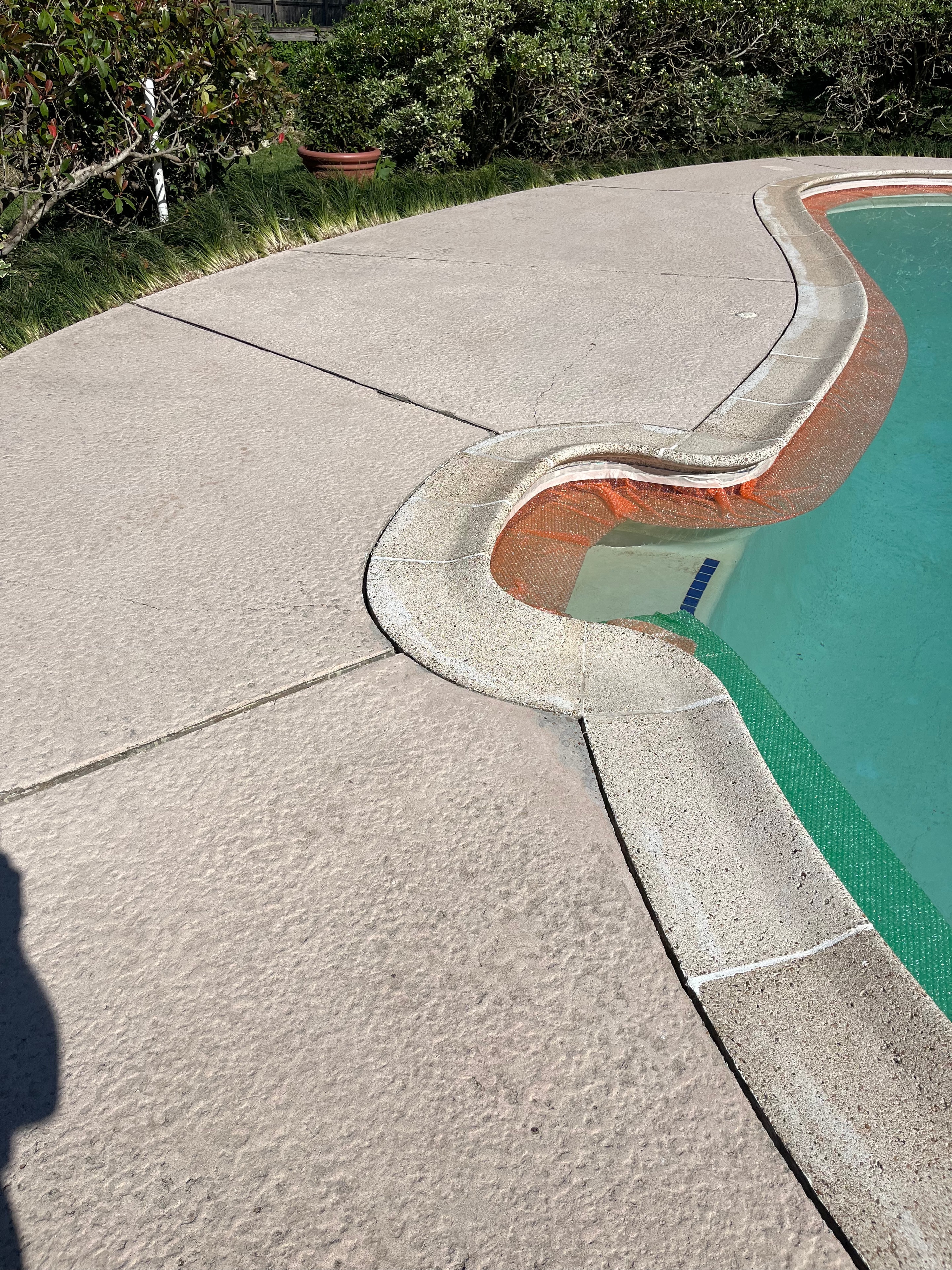 Pool deck before resurfacing